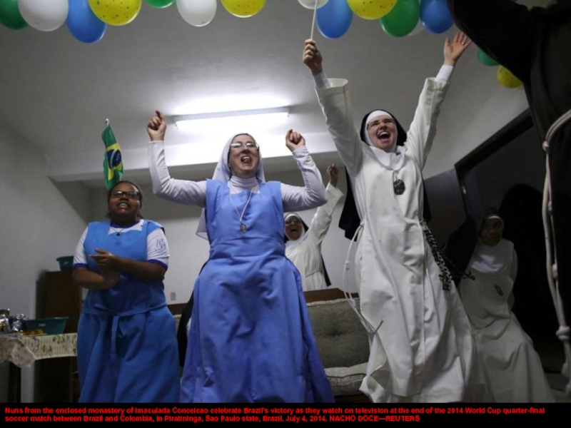 Nuns from the enclosed monastery of Imaculada Conceicao celebrate Brazil's victory