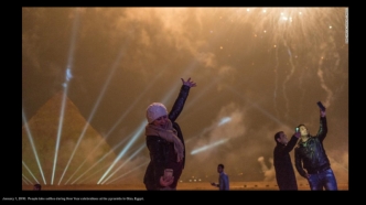 January 1, 2016:  People take selfies during New Year celebrations at the pyramids in Giza, Egypt.